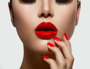 Red sexy lips and nails closeup manicure and makeup