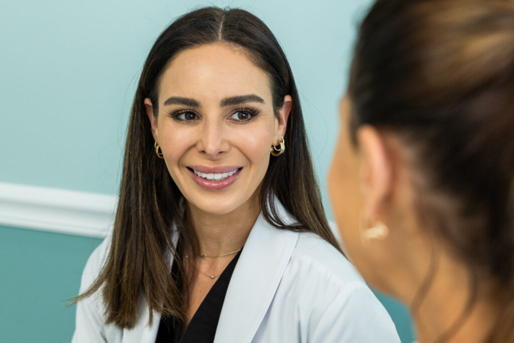 A Hermann provider meets with a patient to discuss whether masseter Botox in St. Petersburg is right for her.